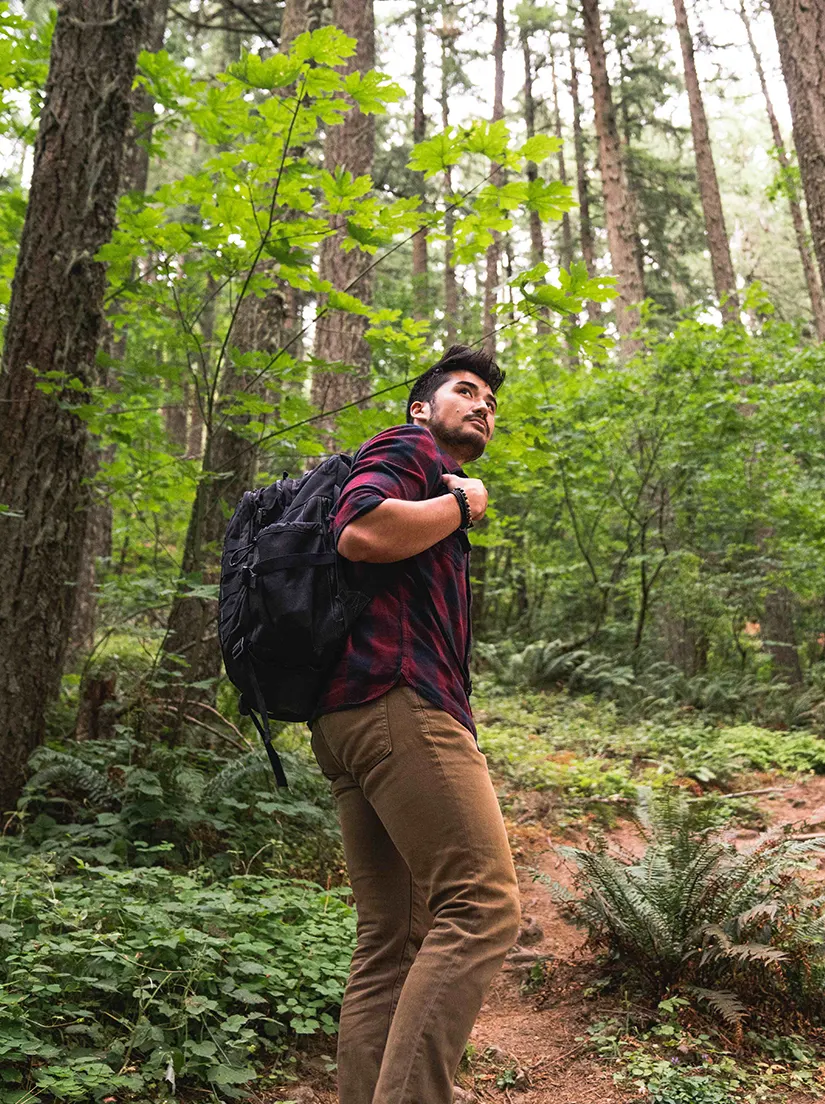 Student hiking through Oregon forest