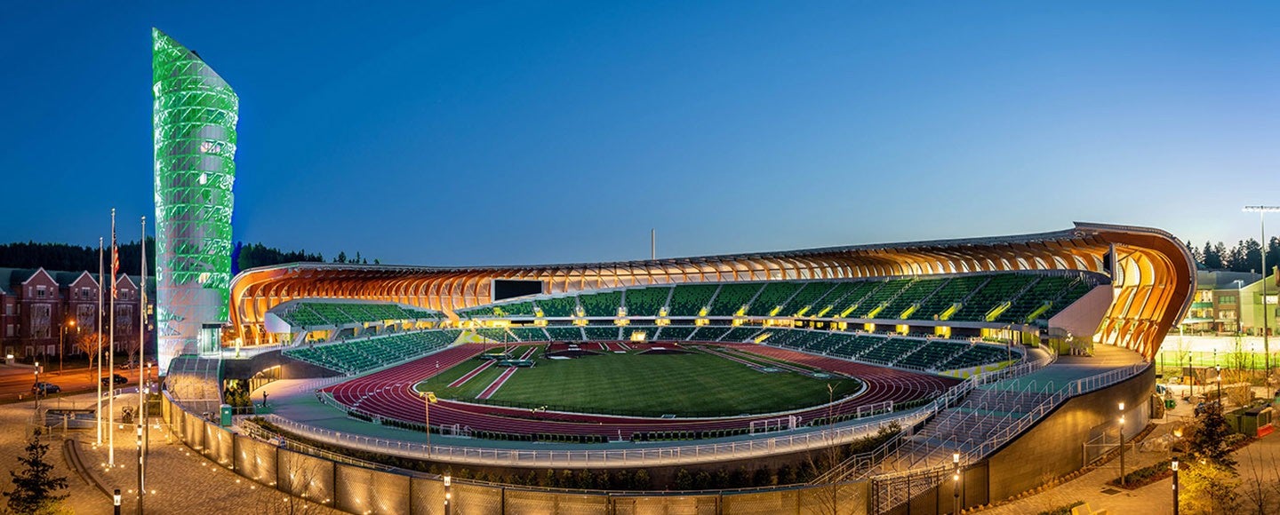 Hayward Field with the tower lit up in green