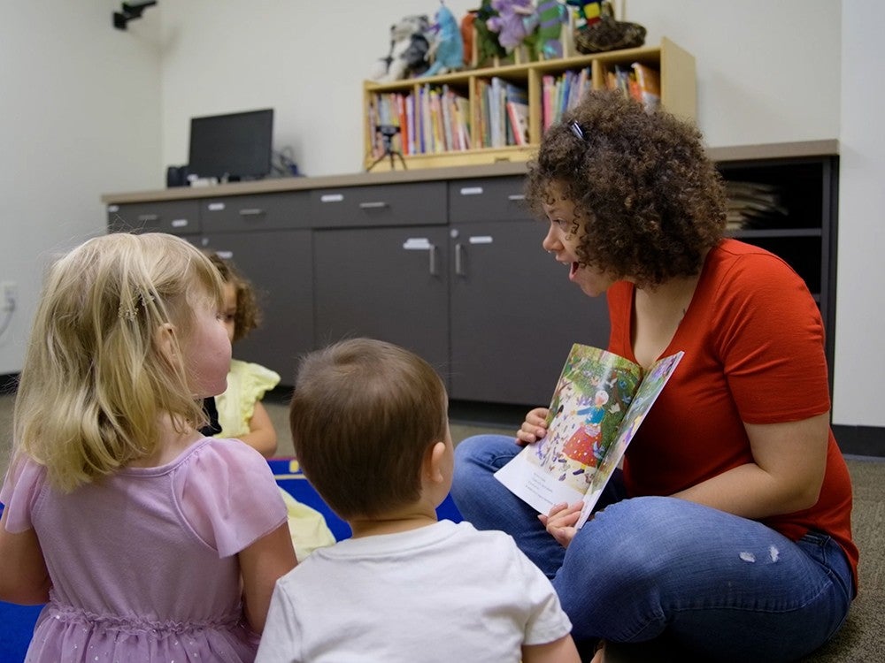 College of Education student reading to children