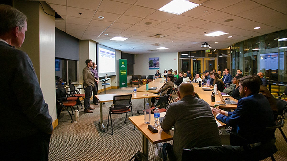 Two startup executives discuss their business in a college seminar